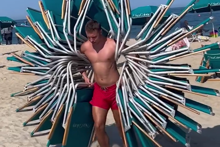 Guy Carries 26 Beach Chairs at One Time